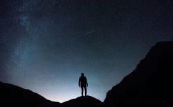 man on mountain at night