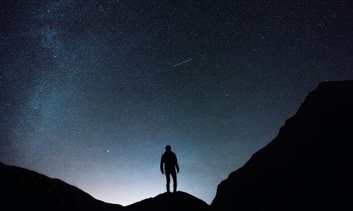 man on mountain at night